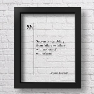 May include: A black framed print with a white background and a quote by Winston Churchill: "Success is stumbling from failure to failure with no loss of enthusiasm."