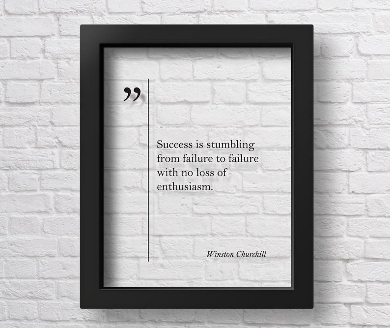 May include: A black framed print with a white background and a quote by Winston Churchill: "Success is stumbling from failure to failure with no loss of enthusiasm."