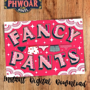 May include: A pink digital download print with the words "FANCY PANTS" in large, bubble letters. The print features various underwear designs hanging on a clothesline, with the text "Instant Digital Download" at the bottom.