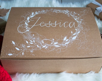 Empty gift box with handwritten name.