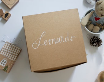 Cardboard gift box with handwritten name.