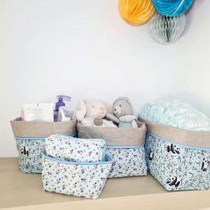 Diaper basket, coated linen changing table baskets and panda printed fabric on a blue background