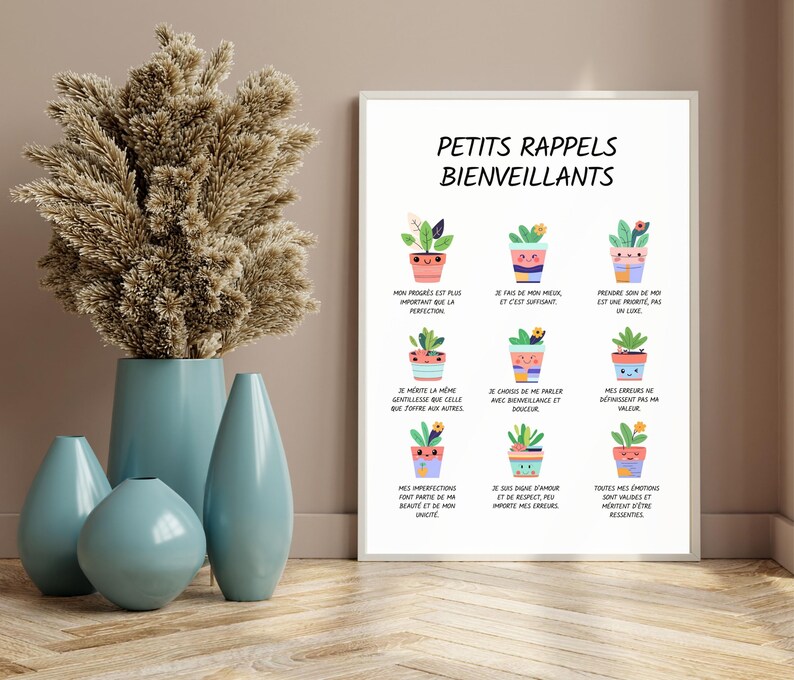 May include: A framed print with the text "PETITS RAPPELS BIENVEILLANTS" and illustrations of potted plants. A collection of blue vases and a vase with dried flowers are in the foreground.