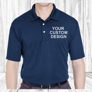 May include: A navy blue polo shirt with a white embroidered design that says "YOUR CUSTOM DESIGN".