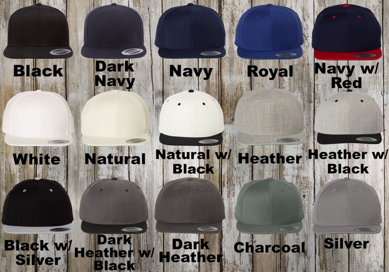 A collection of custom Flexfit hats. The collection includes colors: Black, charcoal, white, brown, purple, gold, grey, spruce, navy, royal, light blue, Kelly green, silver, olive, stone, khaki, coyote brown and dark navy.