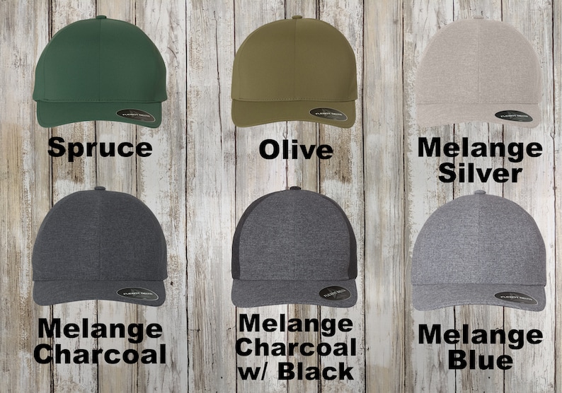 May include: Six baseball caps in different colours. The caps are all the same style, with a curved brim and a mesh back. The colours are spruce, olive, melange silver, melange charcoal, melange charcoal with black mesh, and melange blue.