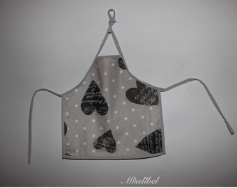 Apron in laminated cotton hearts patterns on gray background with white dots for child