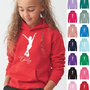 May include: Red hooded sweatshirt with a white silhouette of a figure ice skating and the name "Emily" printed on the front. The sweatshirt is available in a variety of colors.