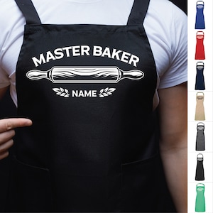 May include: Black apron with white text that reads "Master Baker" with a rolling pin and wheat stalks. The text "NAME" is below the rolling pin.