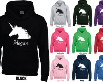 May include: A black hoodie with a white unicorn silhouette and the name "Megan" printed on the front. The hoodie is available in 10 different colors, including black, sport grey, forest, purple, heliconia, Irish green, red, light pink, navy, and royal.
