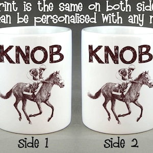 May include: White ceramic mug with a brown illustration of a horse and jockey. The text "KNOB" is printed in brown on the mug. The mug is shown from both sides.