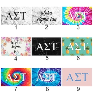 May include: Nine different designs for a sorority tote bag featuring the letters "ΑΣΤ" and the words "alpha sigma tau". The designs include marble, tie-dye, pineapple, and floral patterns.