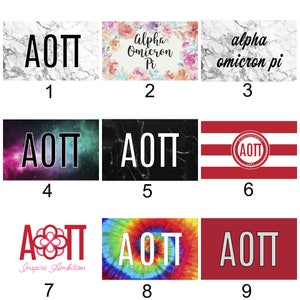 May include: Nine different designs for a sorority or fraternity Greek letter design. The designs include marble, tie-dye, galaxy, and floral patterns. The letters are "AOT".