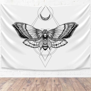 May include: Black and white tapestry featuring a detailed illustration of a moth with geometric patterns and a crescent moon.