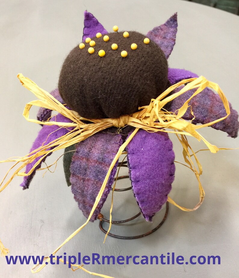 Coneflower pincushion on a bedspring Wool kit!
