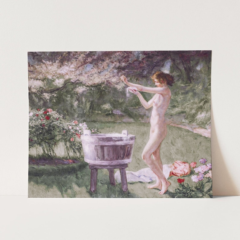 A vintage painting with pinks and green hues of a woman bathing in a meadow.