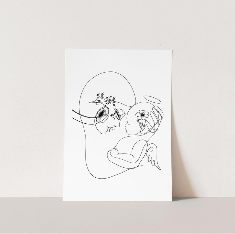 May include: A black and white line drawing of a mother and child. The mother is holding the child in her arms, and the child has a halo above its head. Both figures are adorned with delicate floral details.