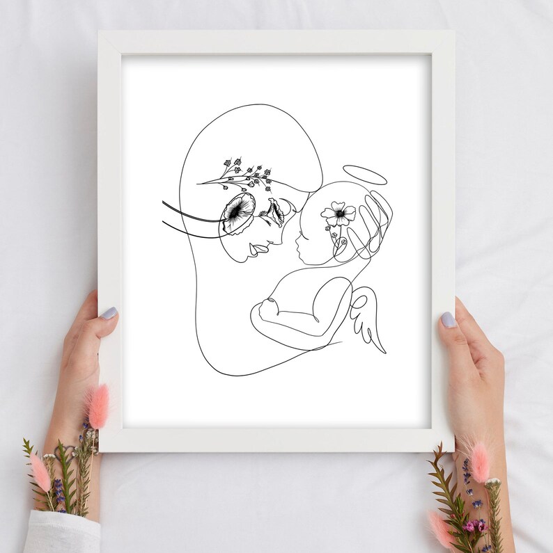 May include: A black and white line drawing of a mother and child. The mother is holding the child in her arms, and the child has a halo above its head. The drawing is stylized and abstract, with flowers and leaves incorporated into the lines.