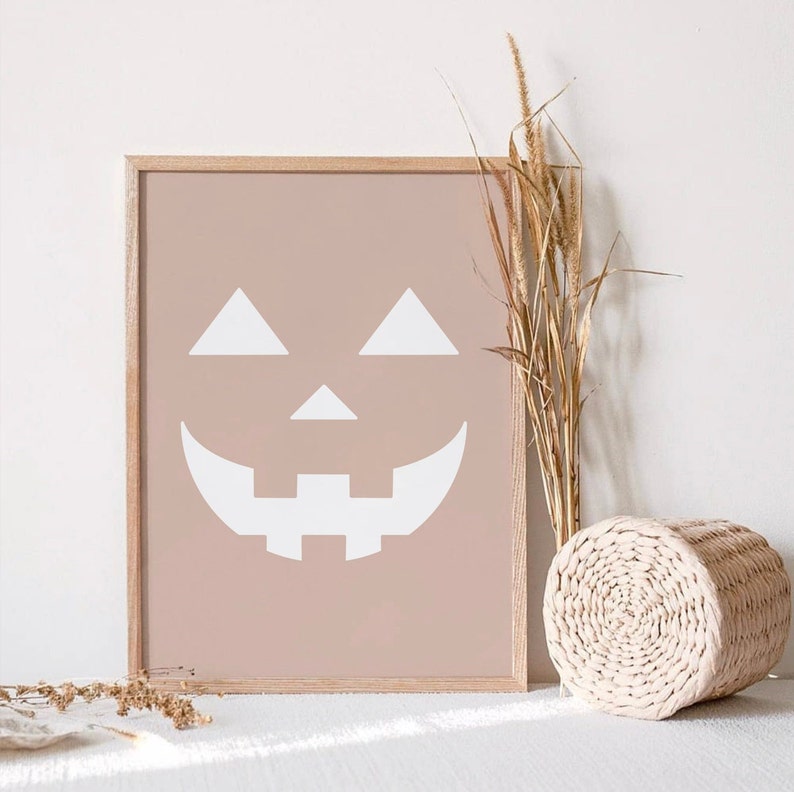 Three Halloween prints. The first print features two blush colored bats, the second print is a blush colored jack’o-lantern and the third print is two adorable blush colored ghosts.