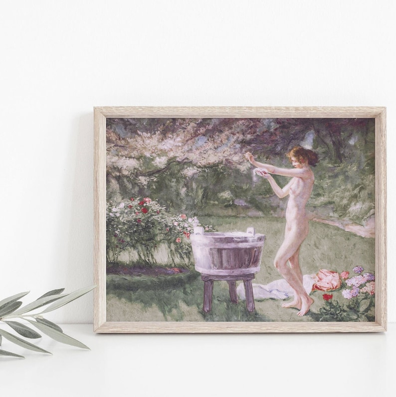 A vintage painting with pinks and green hues of a woman bathing in a meadow.