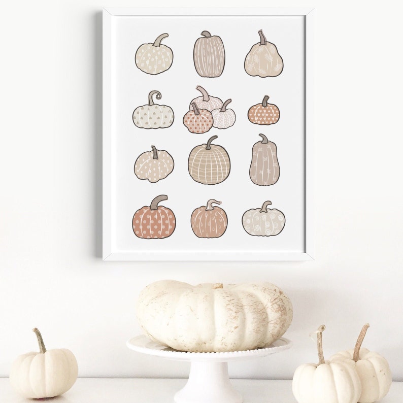 This boho autumn seasonal printable features scattered pumpkins painted in pastel earthy orange, brown and beige colors. Perfect printable art for any home this fall season!