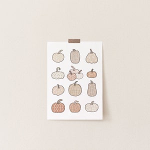 This boho autumn seasonal printable features scattered pumpkins painted in pastel earthy orange, brown and beige colors. Perfect printable art for any home this fall season!