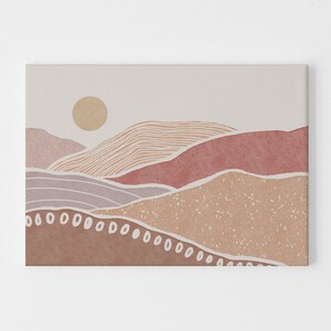 Peut inclure: Impression d'art abstrait repr&eacute;sentant un paysage stylis&eacute; avec des collines superpos&eacute;es dans des tons de rose, brun et beige. L'impression comprend un soleil dans le coin sup&eacute;rieur gauche et une bordure blanche.
