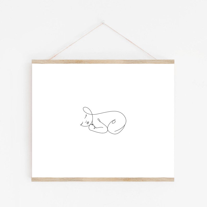 Puede incluir: Un dibujo en blanco y negro de un beb&eacute; durmiendo en un estilo simple y minimalista.