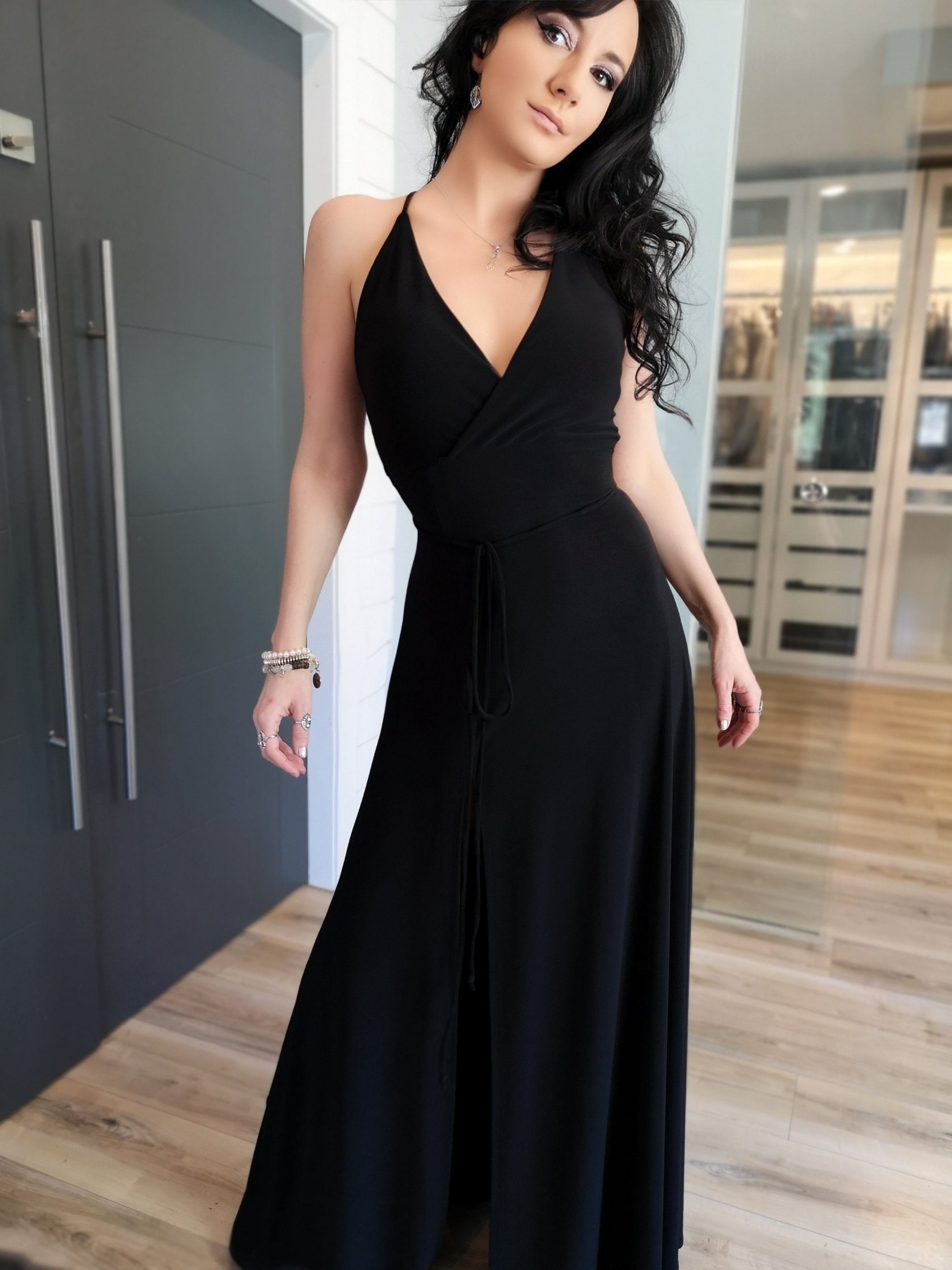 Black open back maxi dress with slit. Black open back maxi dress with slit.