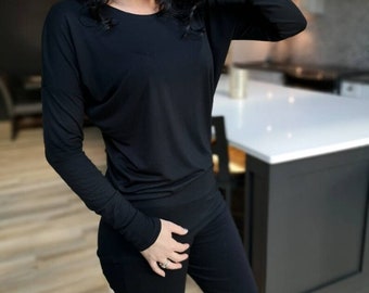 Black long sleeve drapery tunic top.