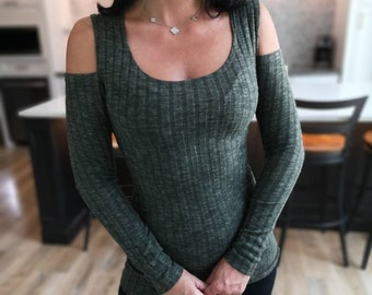 Fuzzy soft green long-sleeve cold shoulder shirt. Had enough to make a couple singles.