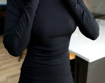 Beautiful fitted long sleeve ribbed black turtleneck top.