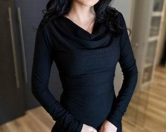 Black long sleeve cowl neck fitted top.