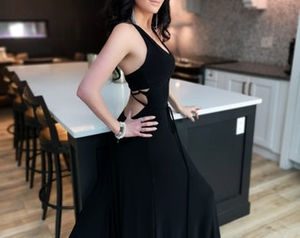 Black backless maxi dress. This dress features an exposed back with a beautiful string details. Classy, sexy and fun.