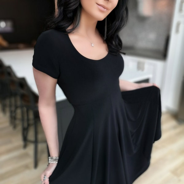 Short black dress with cap sleeve.