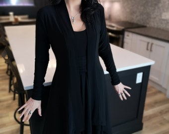 Long black cardigan. This cardigan is sure to be a go-to piece for everyday wear.