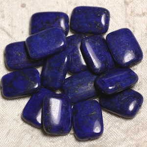 May include: A group of 14 smooth, rectangular lapis lazuli beads in various shades of blue. The beads have a slightly irregular shape and are arranged in a cluster.