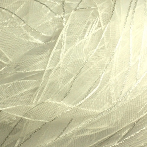 May include: White sheer fabric with a delicate, woven pattern. The fabric has a soft, flowing texture and a subtle sheen.