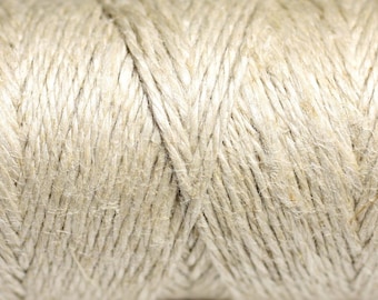 May include: Close-up of natural beige twine, showing the texture of the fibers and the way the strands are twisted together.