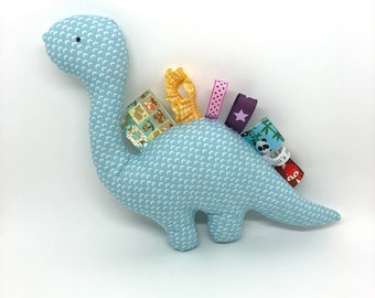 Blue plush dinosaur and ribbons, adorable cloud fabric