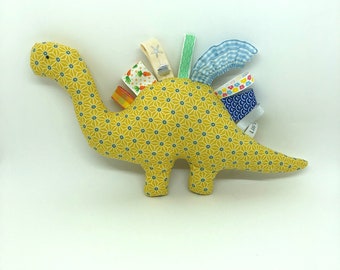 Yellow plush dinosaur and ribbons, adorable Japanese-inspired star fabric