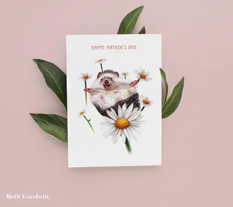 Greetings card featuring a hand-drawn Hedgehog surrounded by daisies with text that reads"Happy Mother's Day"