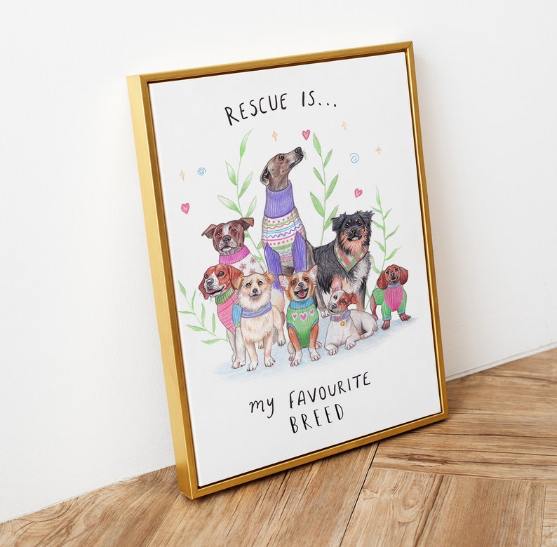 May include: A framed print with a watercolor illustration of a group of dogs wearing sweaters. The text "RESCUE IS... my FAVORITE BREED" is written below the dogs.