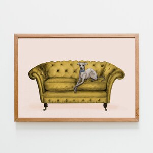 May include: A framed illustration of a grey Italian Greyhound dog wearing a blue bow tie, lounging on a yellow tufted sofa.