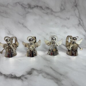 May include: A black and white graphic tee featuring a stylized illustration of a skull wearing a bandana. The text "THUG LIFE" is printed below the skull in bold, white letters. The shirt is likely made of cotton.