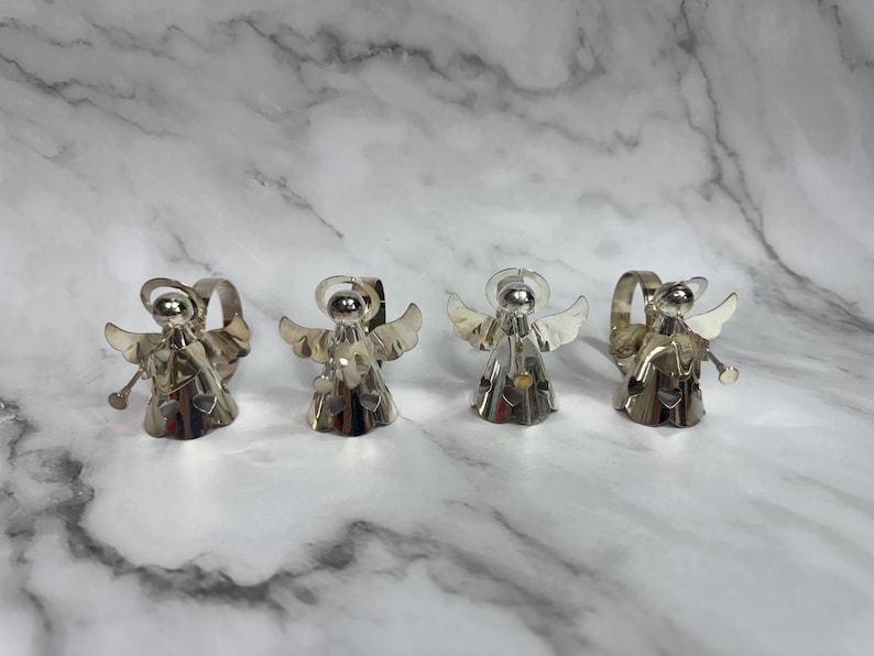 May include: A black and white graphic tee featuring a stylized illustration of a skull wearing a bandana. The text "THUG LIFE" is printed below the skull in bold, white letters. The shirt is likely made of cotton.