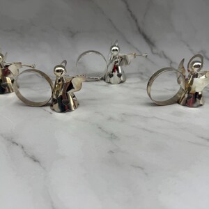 May include: A rustic wooden sign with the text "Welcome to our home" in white lettering. The sign features a distressed finish and a simple, inviting design, perfect for a front porch or entryway.