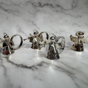 May include: A set of three ceramic nesting bowls in shades of blue, green, and white. The bowls feature a speckled design and varying sizes, perfect for food preparation or serving.