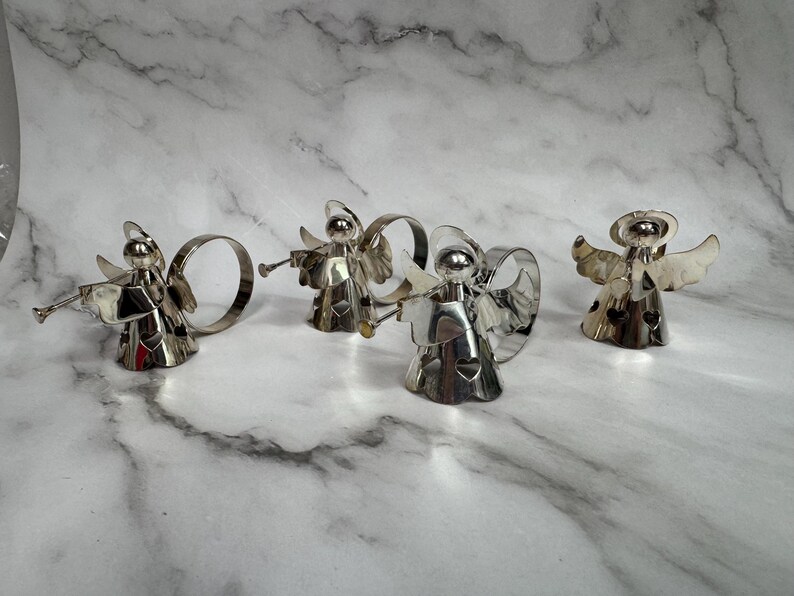 May include: A set of three ceramic nesting bowls in shades of blue, green, and white. The bowls feature a speckled design and varying sizes, perfect for food preparation or serving.