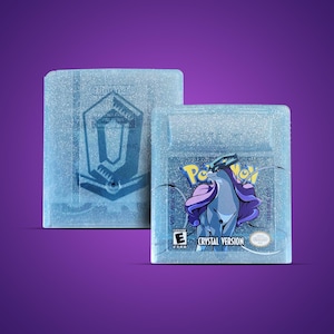 May include: Two light blue Nintendo Game Boy cartridges. One cartridge has a Nintendo logo and a design. The other cartridge has the Pokemon logo, the text "Crystal Version", and a Suicune graphic.